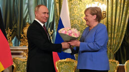 As America Falls, Merkel Runs to Russia